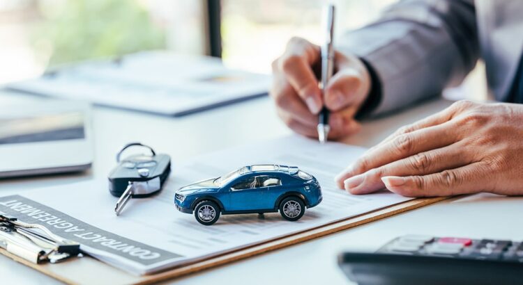 Man signing car insurance document or lease paper. Writing signa